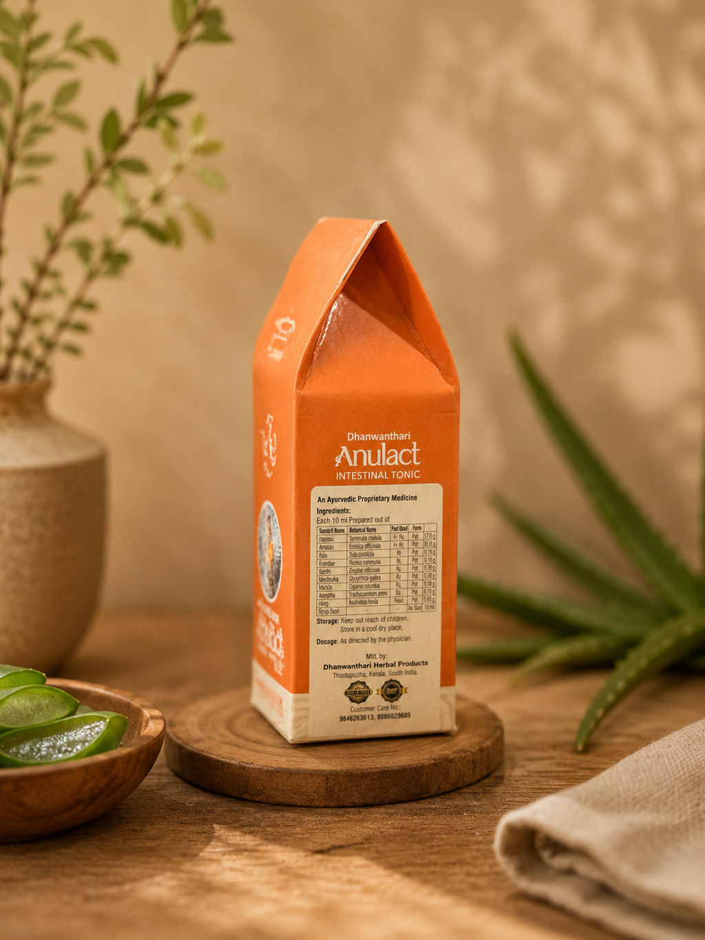 Side view of Herbalever Dhanwanthari Anulact Ayurvedic intestinal tonic showing ingredients and product information.