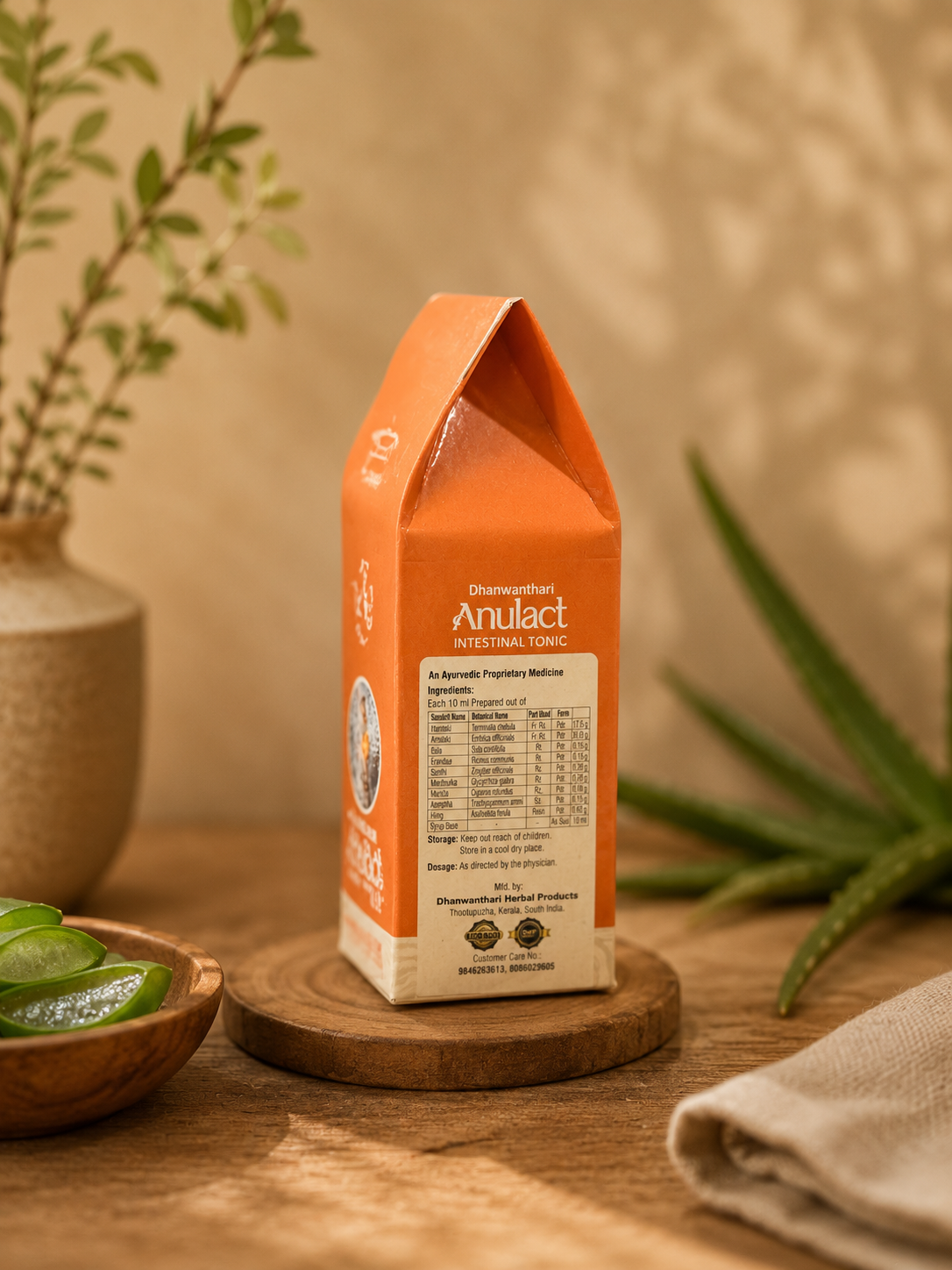 Side view of Herbalever Dhanwanthari Anulact Ayurvedic intestinal tonic showing ingredients and product information.